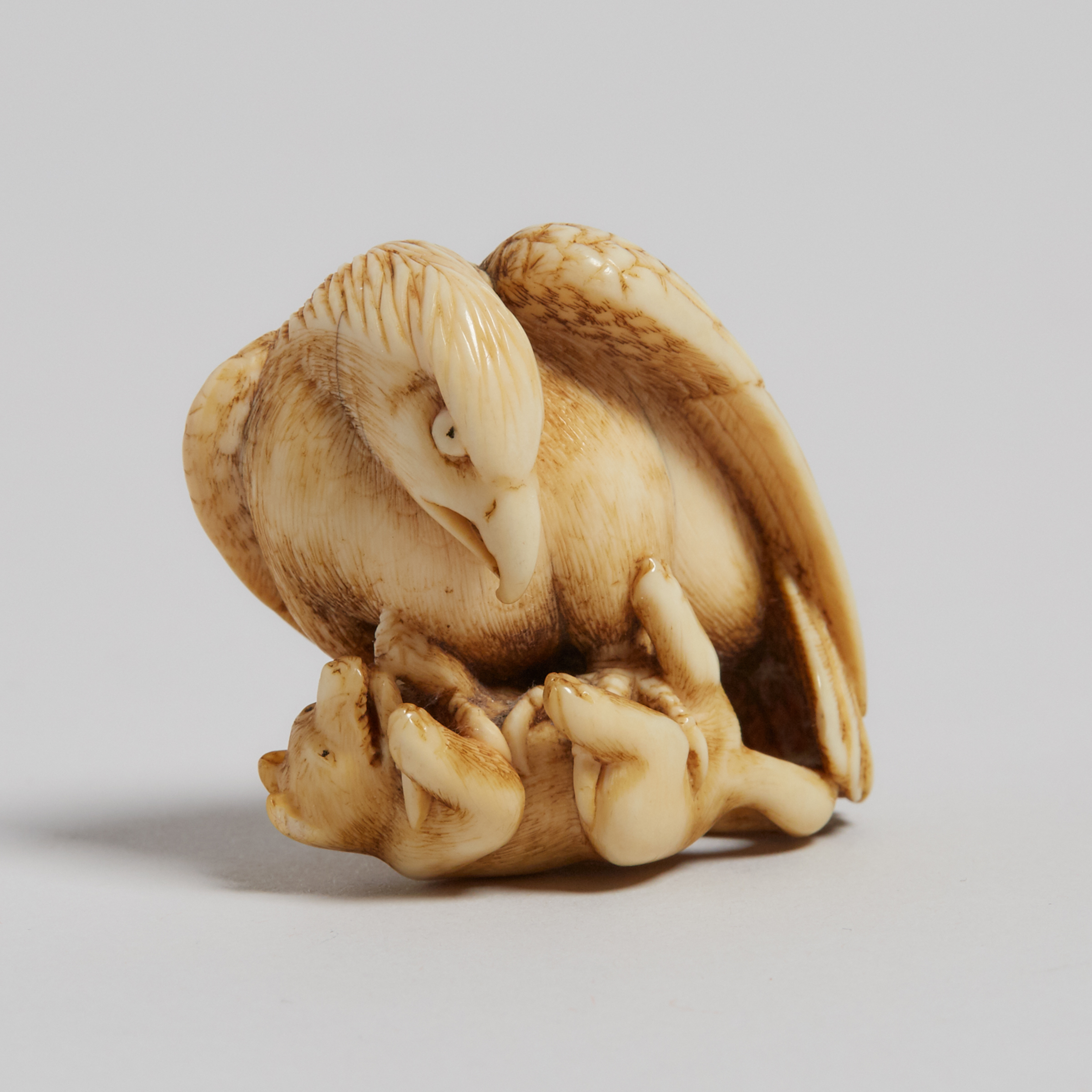 An Ivory Carved Netsuke of an Eagle and a Fox, Signed Tomochika, Late 19th Century