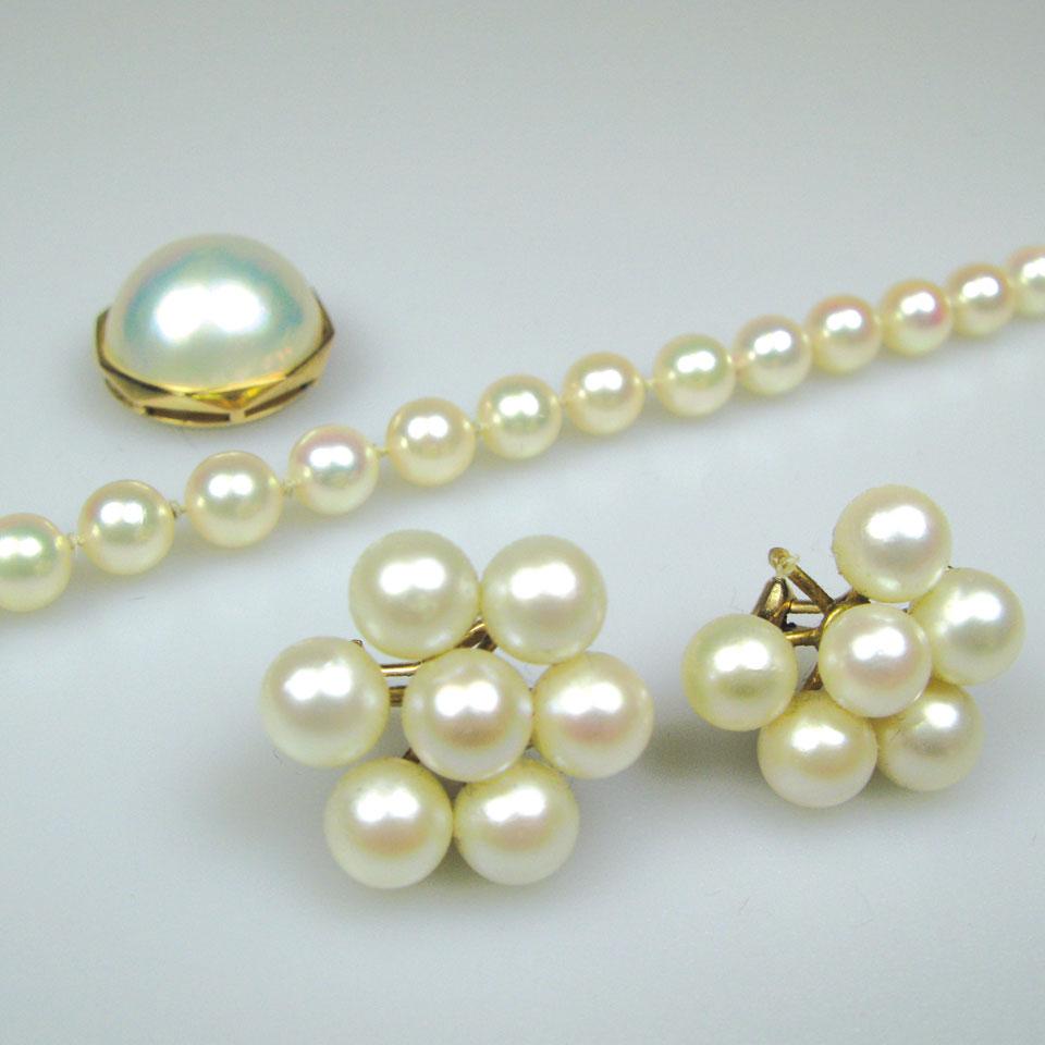 Pair of 14k yellow gold earrings, each set with 7 cultured pearls