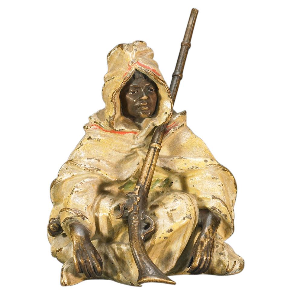 Franz Bergman (Austrian, 1861-1936) Cold Painted Bronze Figure of Seated Bedouin Soldier with Rifle and Sword, 19th century