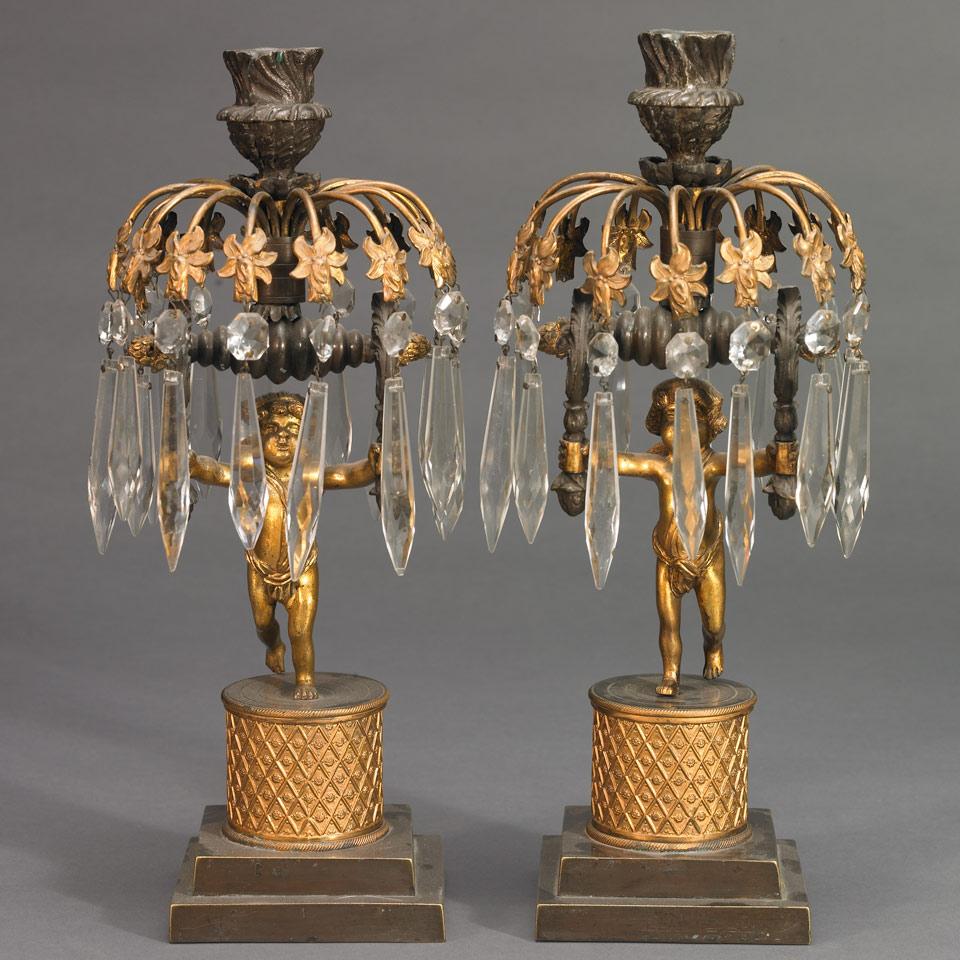 Pair of Patinated and Gilt Bronze Figural Candlesticks, late 19th century