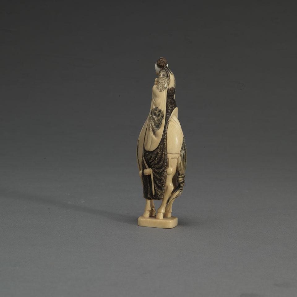 Carved Chinese Figure of a Mounted Immortal