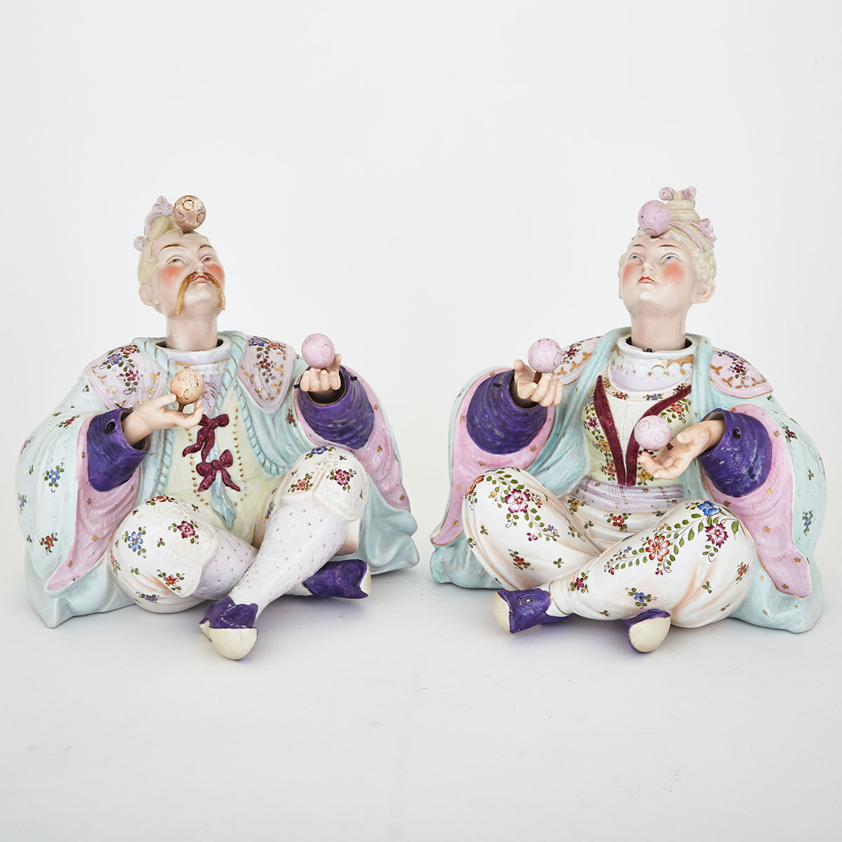 Pair of Continental Porcelain Nodding Jugglers, probably Dresden, late 19th century