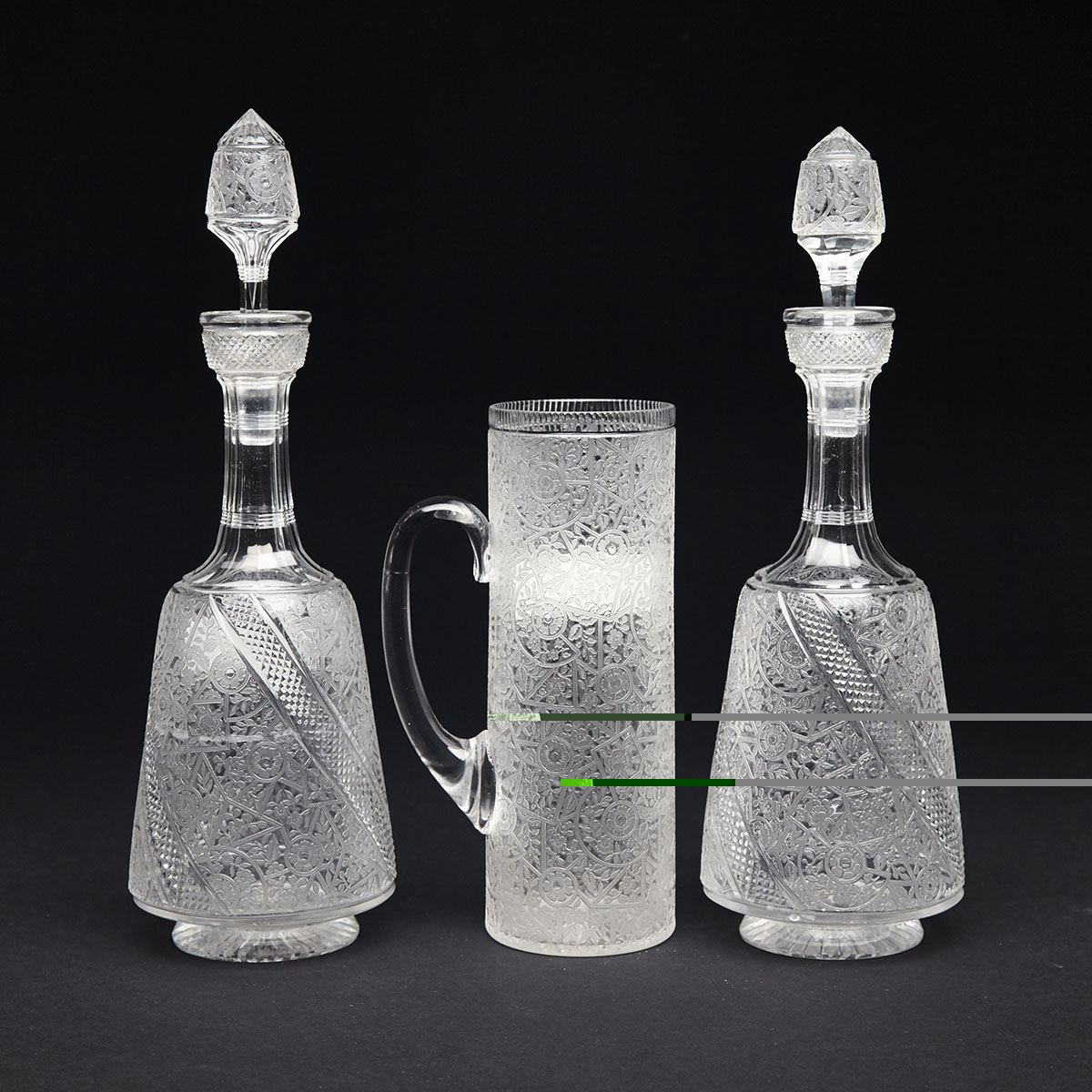 Pair of Grice Bros. Cut and Etched Glass Decanters and a Jug, 1880s