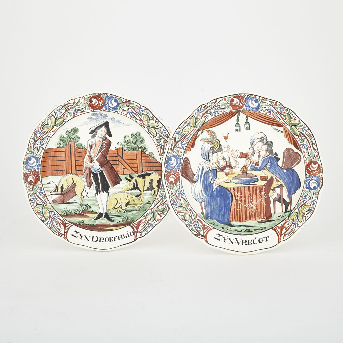 Pair of Dutch-Decorated English Creamware ‘Prodigal Son’ Plates, late 18th century
