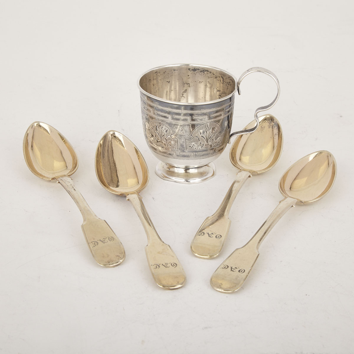 Russian Silver Small Cup, probably Moscow, 1881 and Four Silver-Gilt Fiddle Pattern Tea Spoons, St. Petersburg, 1847