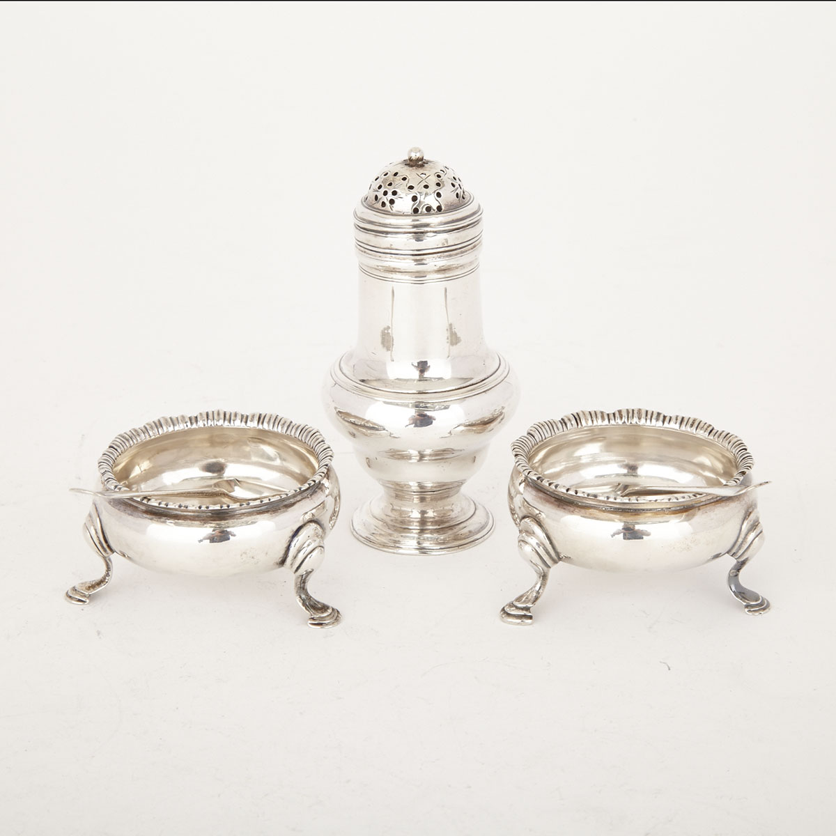 George III Silver Caster, London 1766 and Pair of Salt Cellars with Spoons,  London, 1764