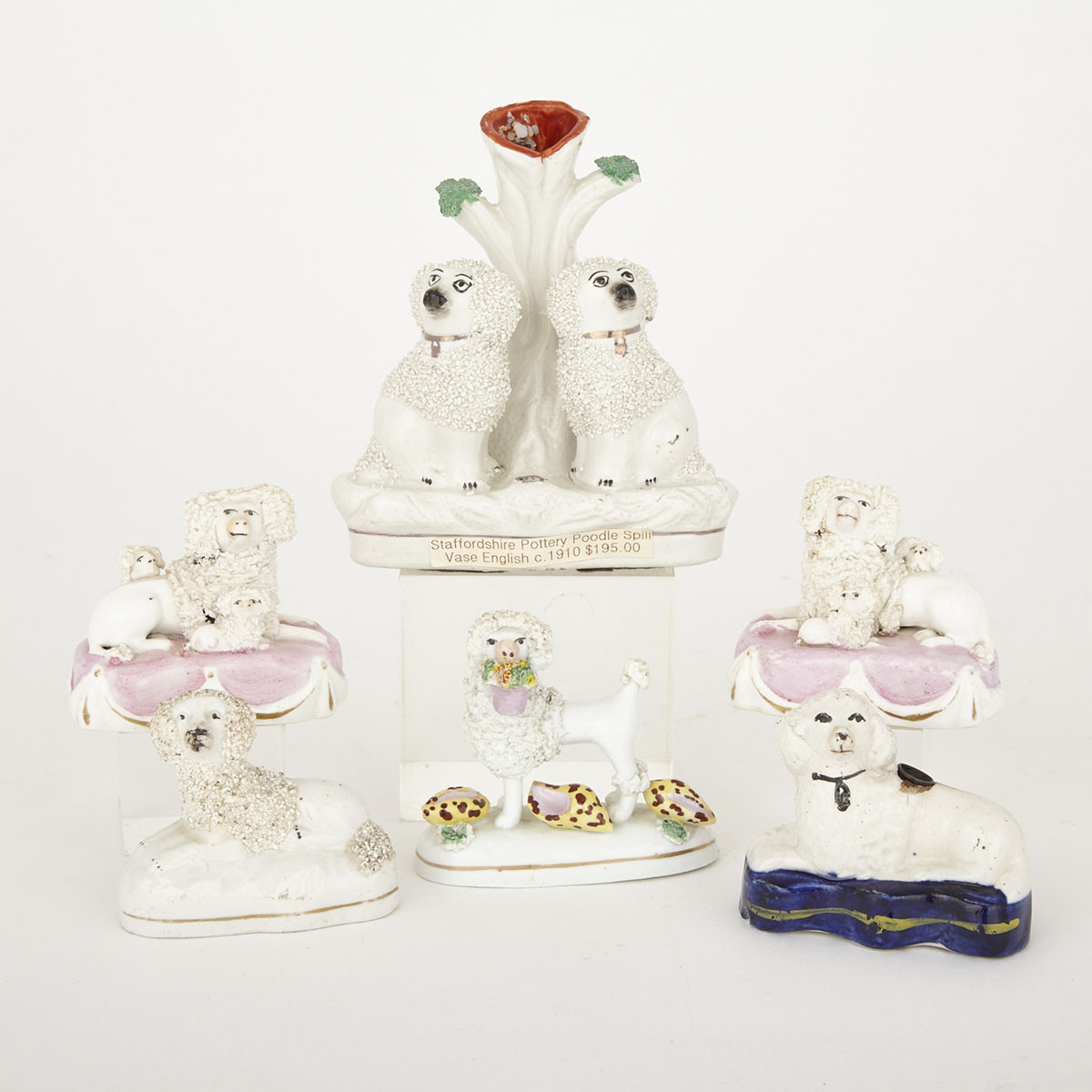 A Group of Staffordshire Pottery and Porcelain Articles with Small Dogs, 19th/20th century