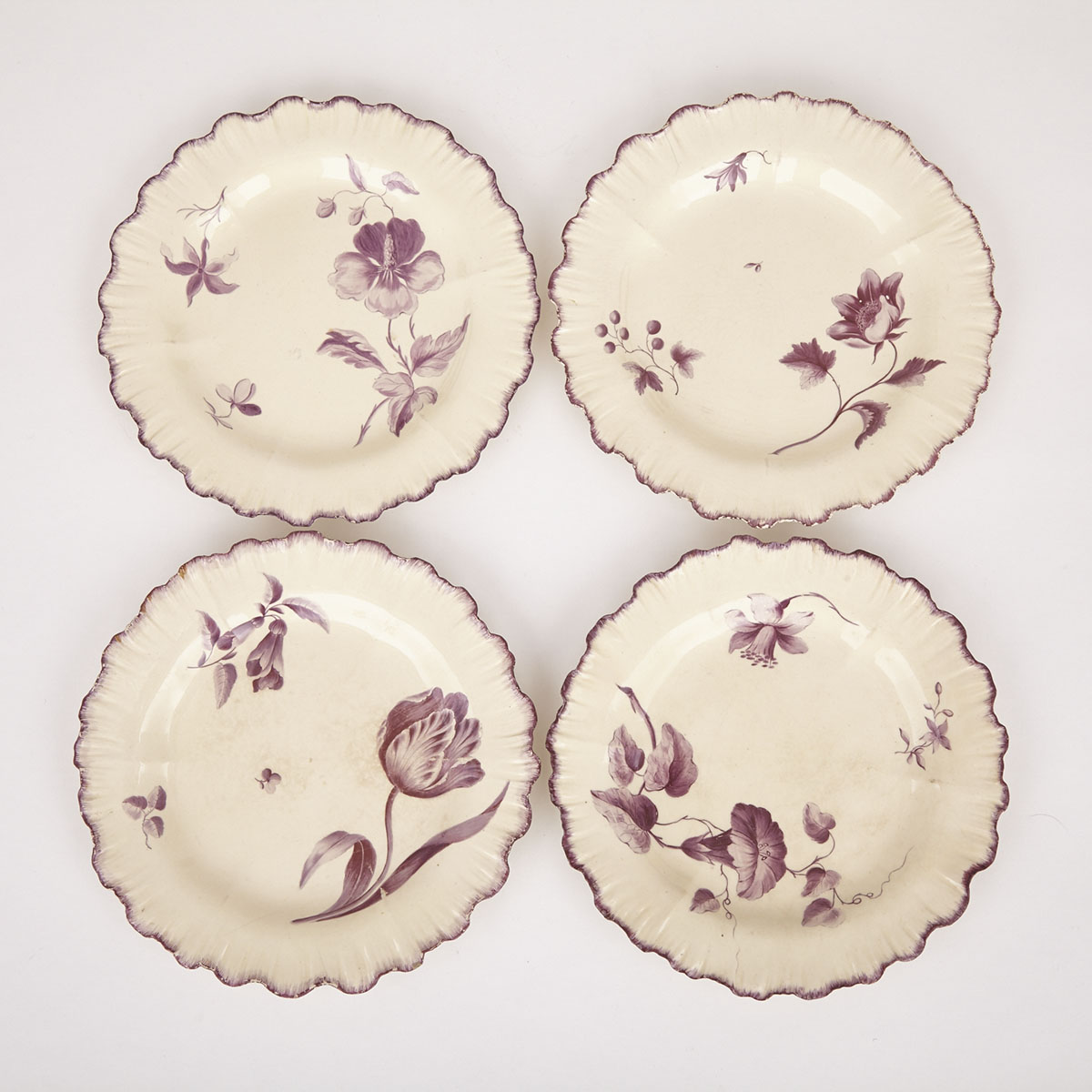 Four English Puce Painted Creamware Plates, 19th century