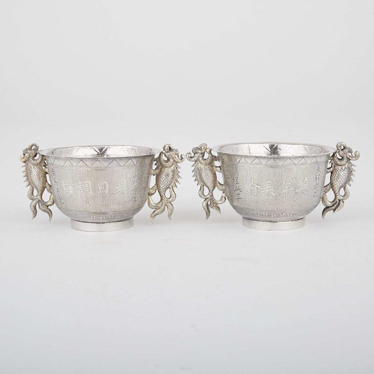 Pair of Silver Fish Dragon Ceremonial Cups, Macau, Early 20th Century