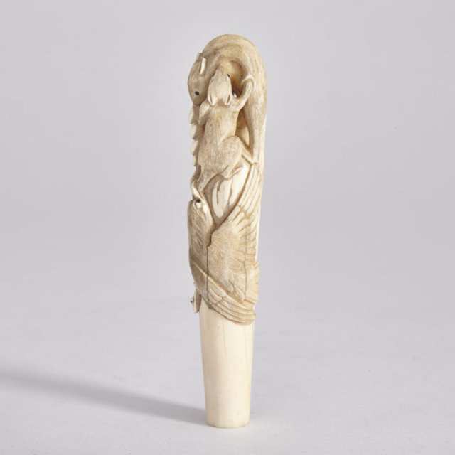 A Carved Japanese Ivory ‘Squirrels and Grapes’ Cane Handle, Meiji Period