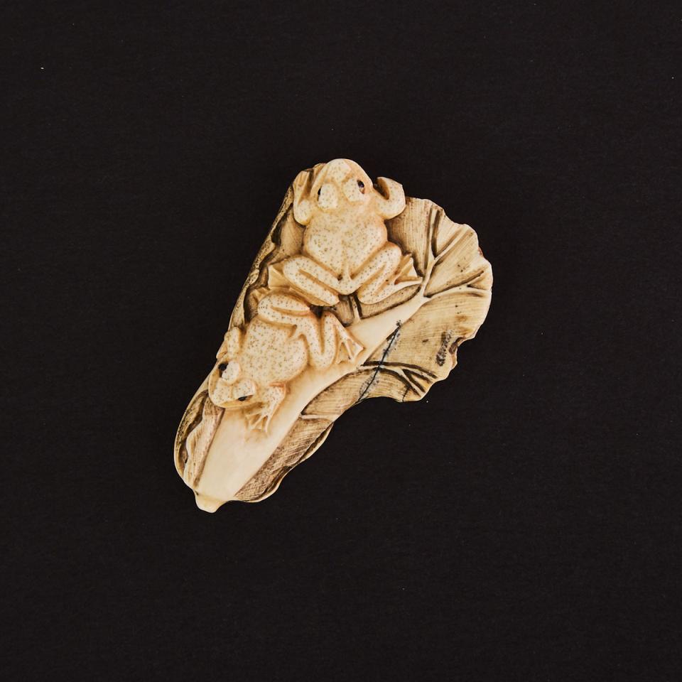 A Mammoth Ivory Netsuke of Frogs and Cabbage