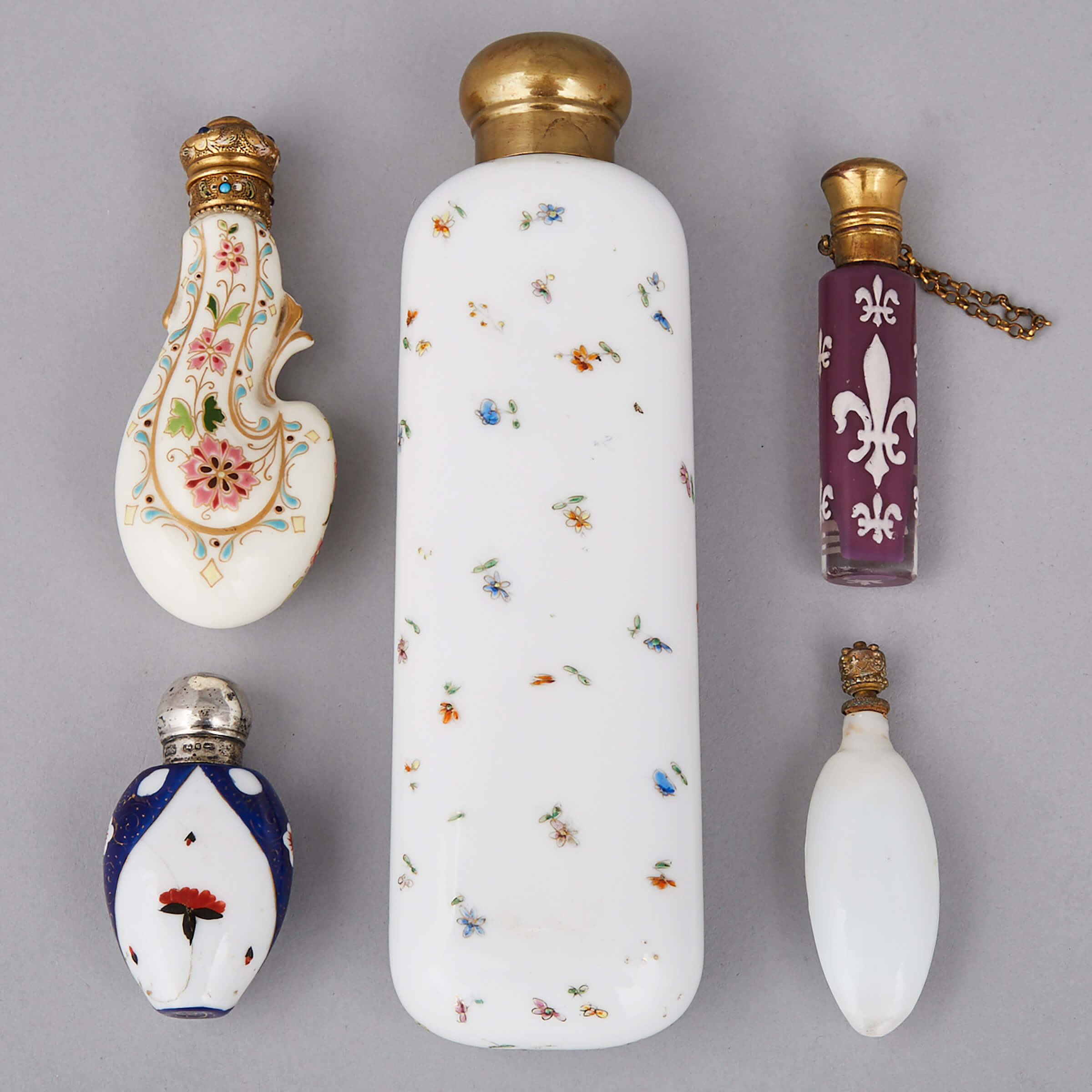 Five Porcelain, Glass, Silver and Metal Mounted Perfume Phials and Toilet Water Bottles, late 19th century