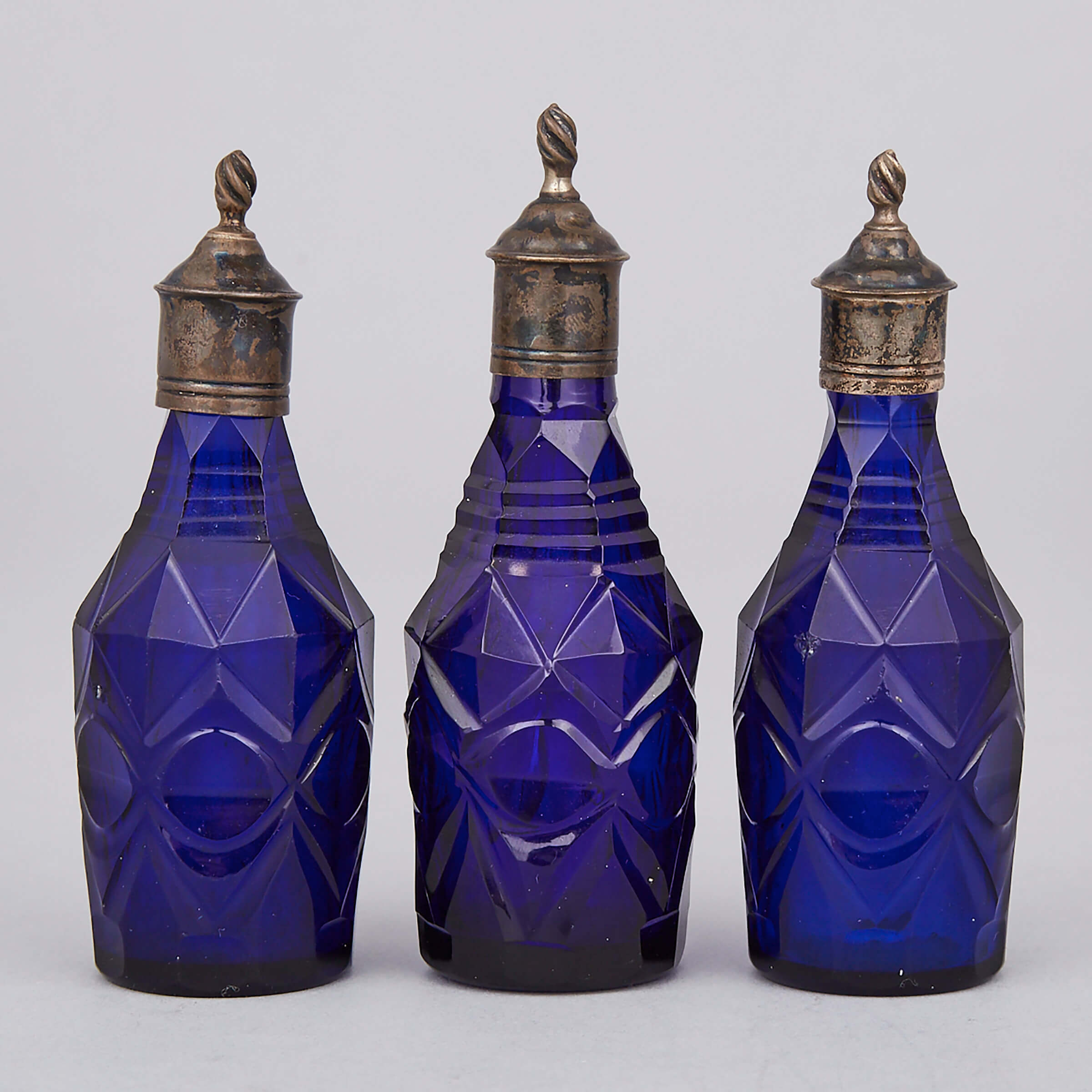 Three Silvered Metal Mounted Cut Blue Glass Small Condiment Bottles, 19th century 