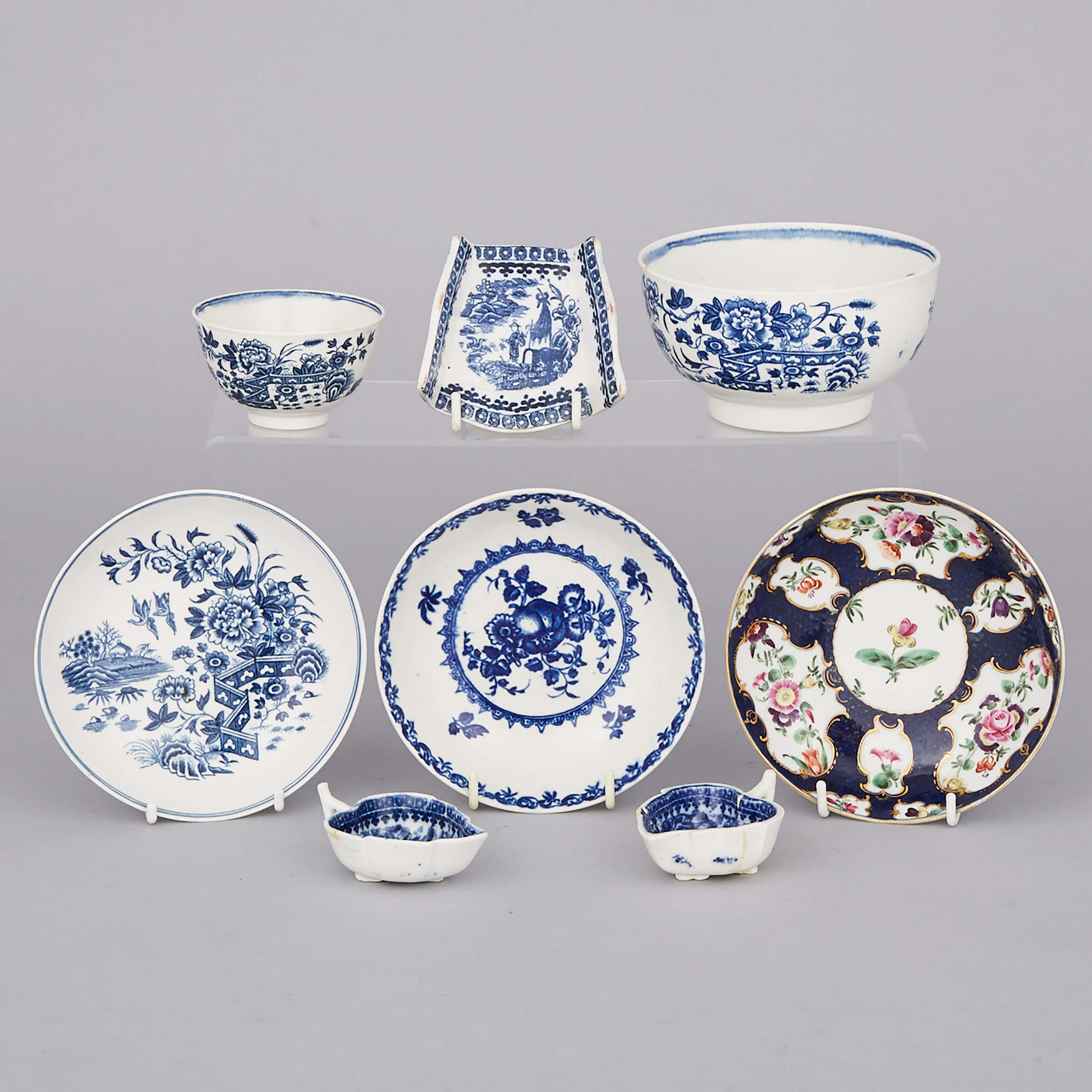 Group of Worcester Blue and White Porcelain and a Scale Blue Ground Saucer, 18th century
