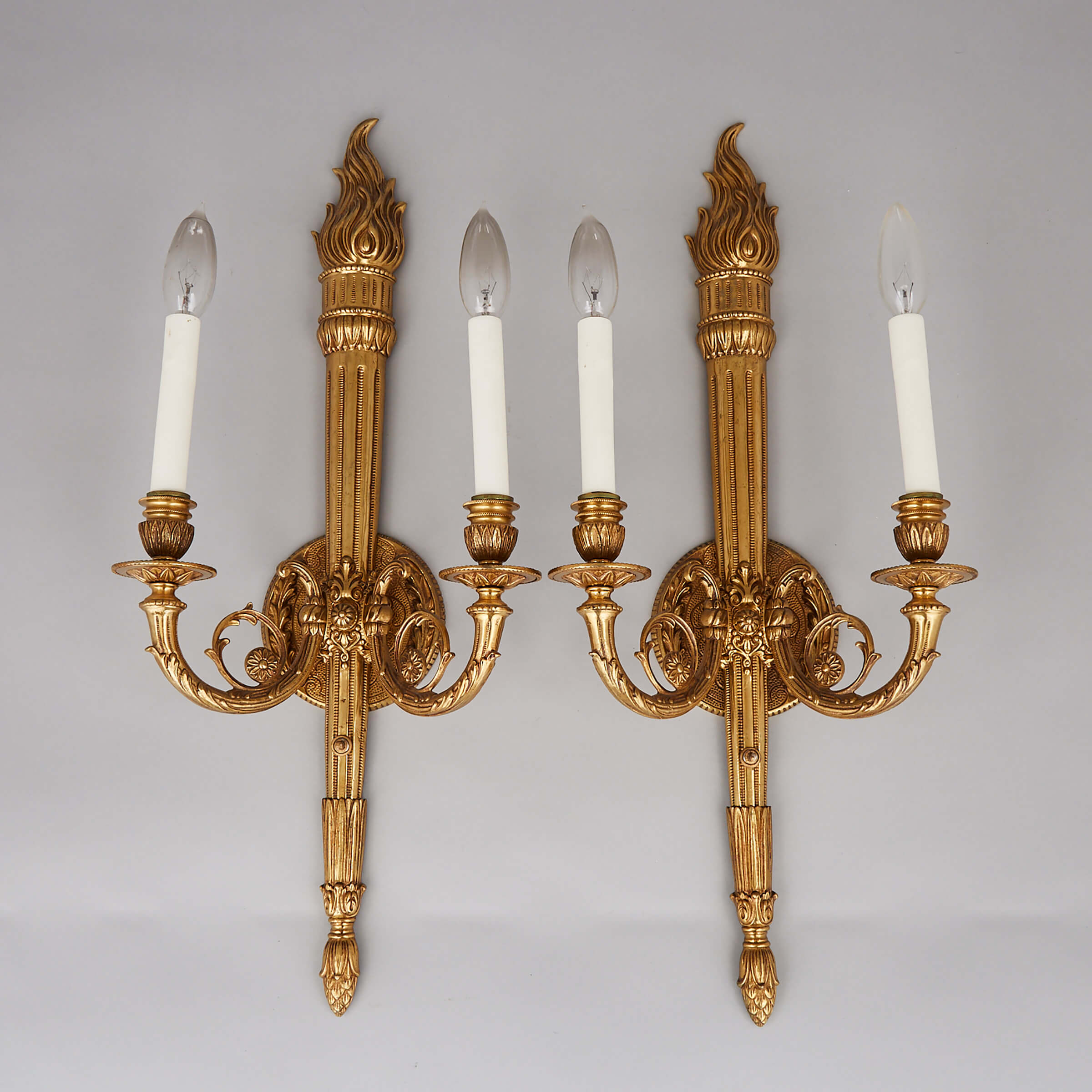 Pair of Louis XVI Style Gilt Brass Torch Form Two Light Wall Sconces, mid 20th century
