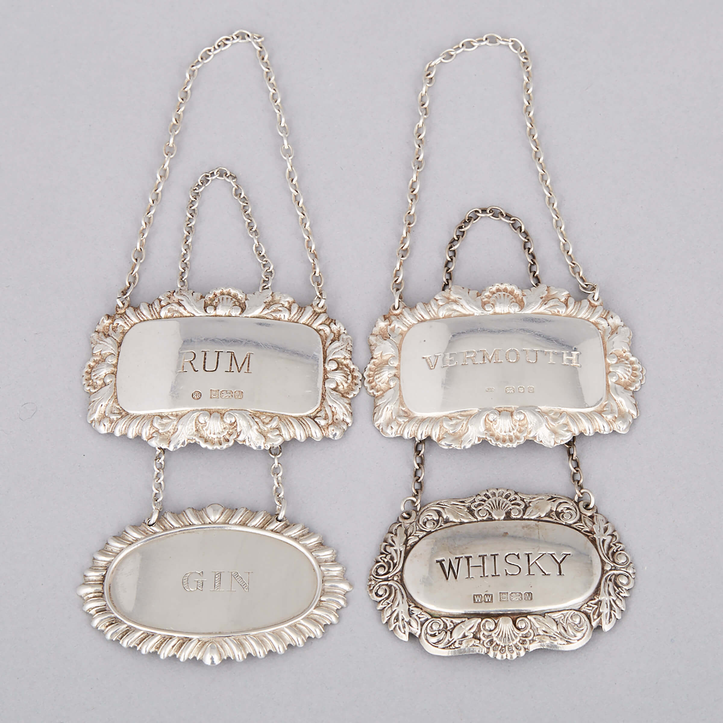 Four English and North American Silver Wine and Spirit Lables, 20th century
