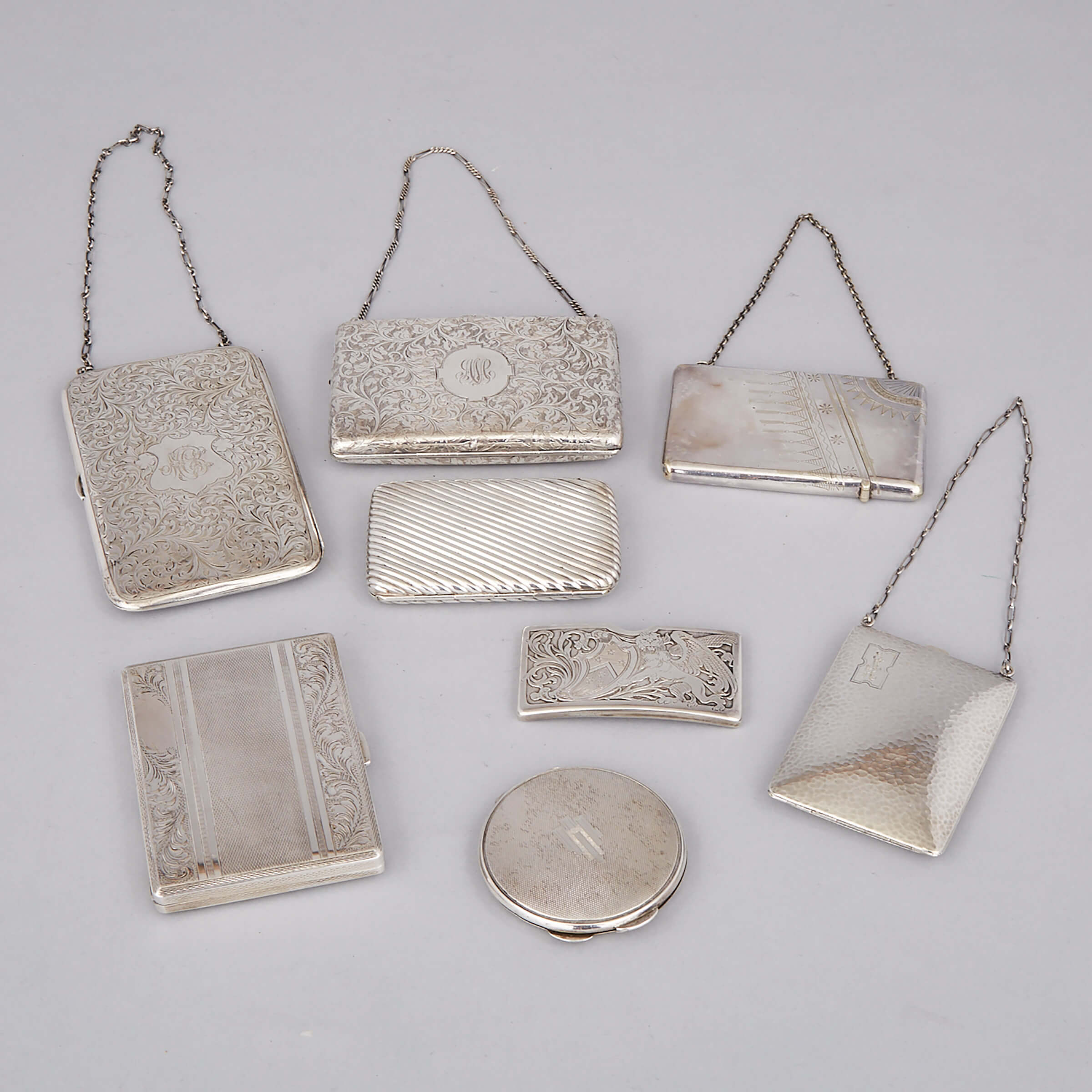 Two Continental Silver Cigarette Cases, English Compact, Three North American Purses and a Card Case, early 20th century
