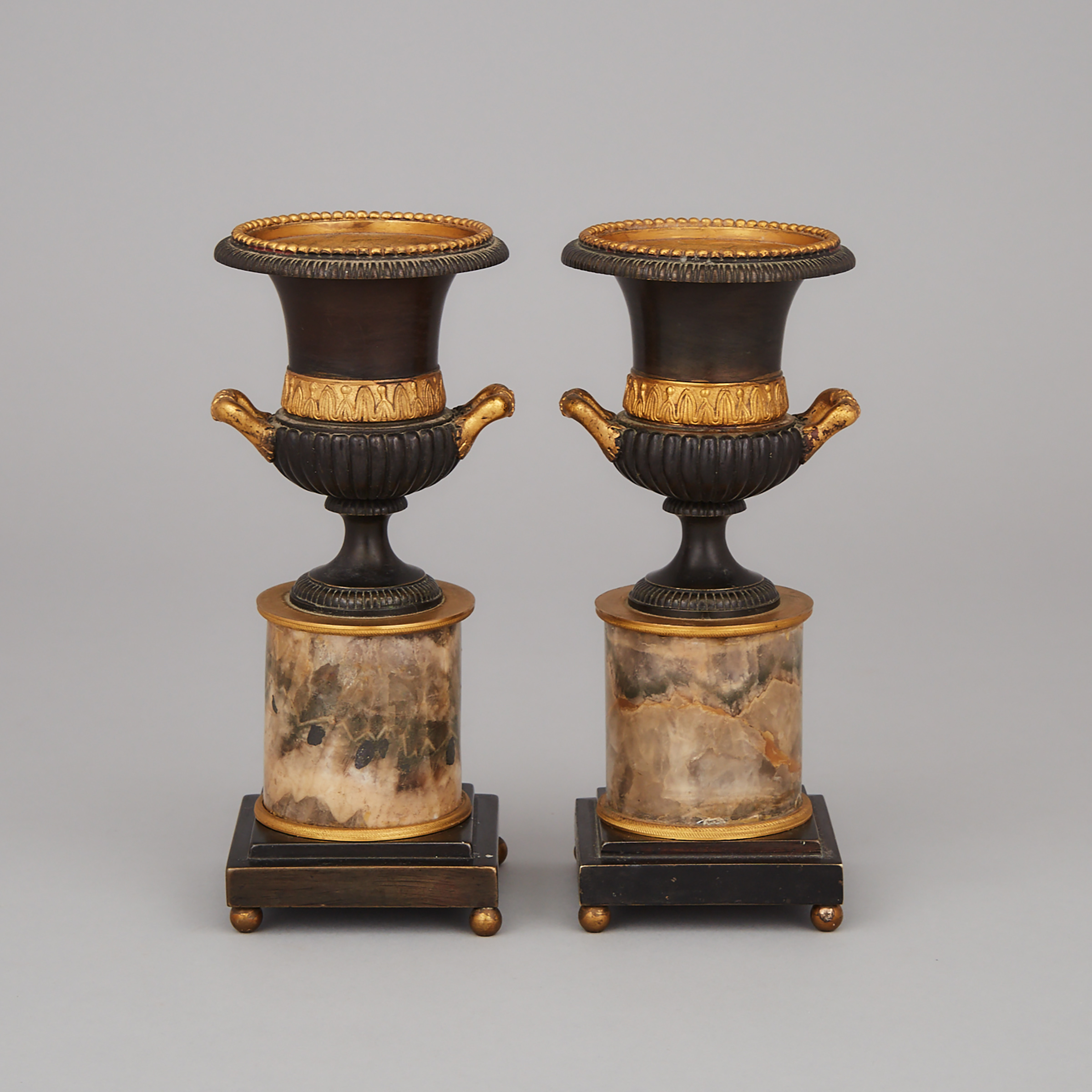 Pair of Regency Neoclassical Gilt and Patinated Bronze Mantle Urns, early-mid 19th century